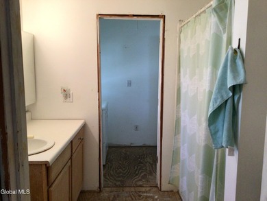 This family-owned two-family home has never been rented. First - photo 22