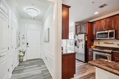Welcome to this highly sought-after first-floor end unit located - photo 6