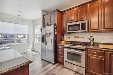 Welcome to this highly sought-after first-floor end unit located - photo 7