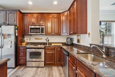 Welcome to this highly sought-after first-floor end unit located - photo 9