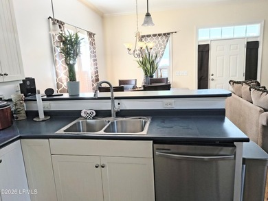This beautifully designed home offers the ease of - photo 7