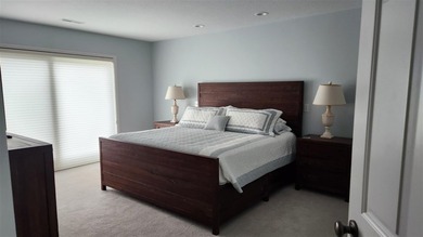 Perched above the Lake Michigan shoreline, this stunning - photo 12