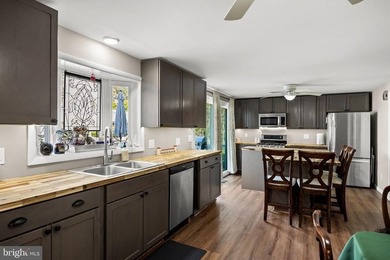 Welcome to this spacious 5-bedroom, 2.5-bath home nestled in the - photo 18