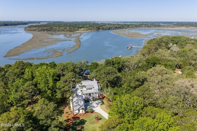 Discover unparalleled waterfront living in this custom-built - photo 1
