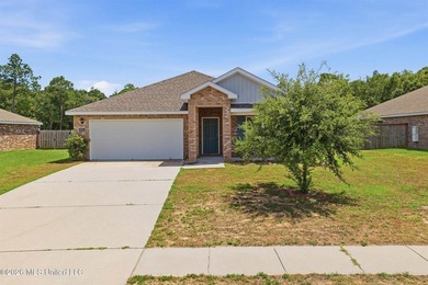 Gorgeous brick home, built in 2022 and located in the highly - photo 1