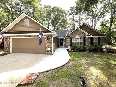 This custom-built 3-bedroom, 2-bath home in Royal Pines is a - photo 1