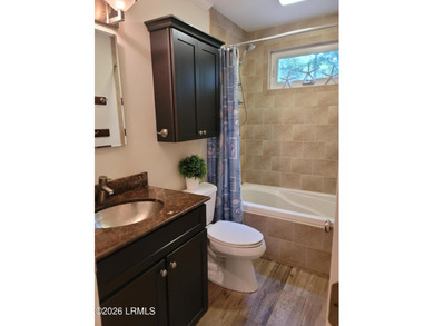 This custom-built 3-bedroom, 2-bath home in Royal Pines is a - photo 6