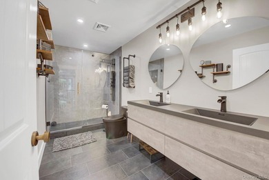 Welcome to 301 Old Mill Road, a masterfully crafted custom-built - photo 16