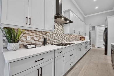 One-of-a-kind custom Gold Coast home, tucked within the private - photo 21