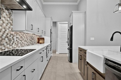 One-of-a-kind custom Gold Coast home, tucked within the private - photo 24