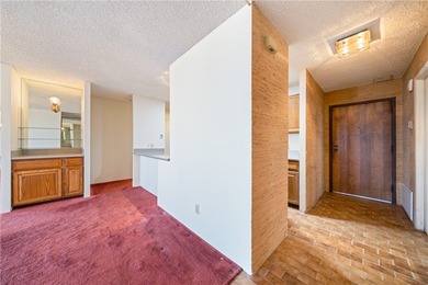 This 5th-floor corner unit offers exceptional views and