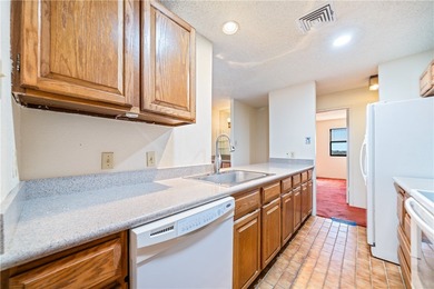 This 5th-floor corner unit offers exceptional views and