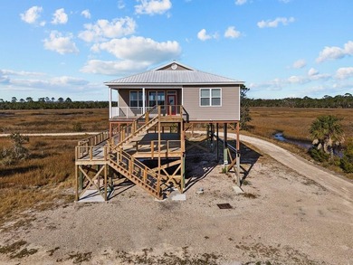 Rare opportunity in Ezell Beach! This elevated two-bedroom, one - photo 1