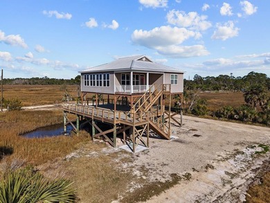 Rare opportunity in Ezell Beach! This elevated two-bedroom, one - photo 2