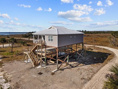 Rare opportunity in Ezell Beach! This elevated two-bedroom, one - photo 3
