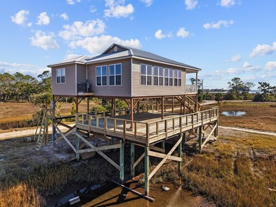 Rare opportunity in Ezell Beach! This elevated two-bedroom, one - photo 4