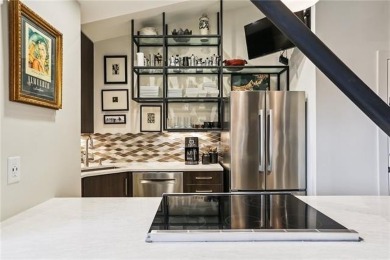 Impressively renovated in 2018, this penthouse-level unit