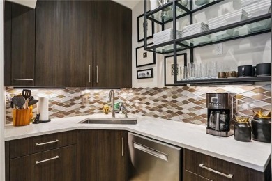 Impressively renovated in 2018, this penthouse-level unit