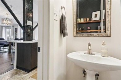 Impressively renovated in 2018, this penthouse-level unit