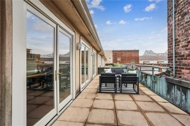 Impressively renovated in 2018, this penthouse-level unit