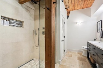 Impressively renovated in 2018, this penthouse-level unit