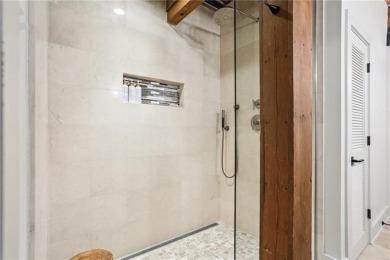 Impressively renovated in 2018, this penthouse-level unit