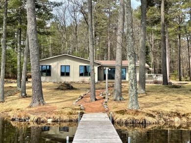 The most idyllic setting surrounded by big pines and oaks. If - Lake Home Sale Pending in Minocqua, Wisconsin
