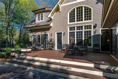 This Adirondack-inspired home is gracefully set atop a wooded - photo 11