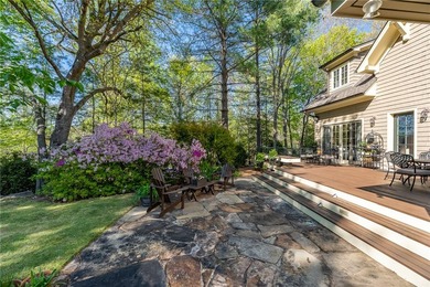 This Adirondack-inspired home is gracefully set atop a wooded - photo 12