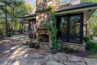 This Adirondack-inspired home is gracefully set atop a wooded - photo 13