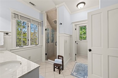 This Adirondack-inspired home is gracefully set atop a wooded - photo 30