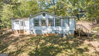 Nestled on a serene three-acre lot, this charming three-bedroom - photo 1