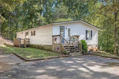 Nestled on a serene three-acre lot, this charming three-bedroom - photo 2
