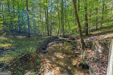 Nestled on a serene three-acre lot, this charming three-bedroom - photo 3