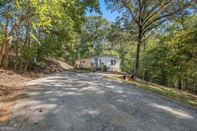 Nestled on a serene three-acre lot, this charming three-bedroom - photo 4