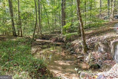 Nestled on a serene three-acre lot, this charming three-bedroom - photo 5