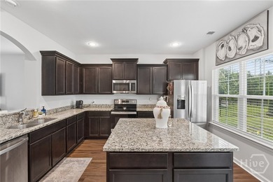 The heart of this this meticulously maintained 5-bedroom - photo 13