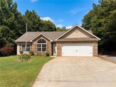 Situated on just over one acre, this well-maintained 3-bedroom - photo 2