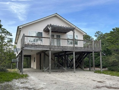 Welcome to Gulf Shores living at its finest! Nestled on a - photo 1