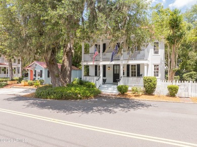 Anchored by a magnificent 400 year old live oak at the front of - photo 1