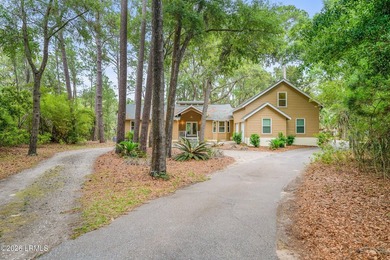 Tucked away on over an acre of wooded privacy with marsh views - photo 1