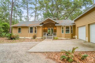 Tucked away on over an acre of wooded privacy with marsh views - photo 2