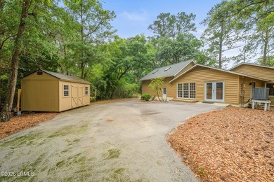 Tucked away on over an acre of wooded privacy with marsh views - photo 3