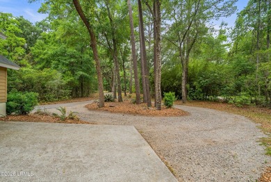 Tucked away on over an acre of wooded privacy with marsh views - photo 4