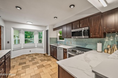 Tucked away on over an acre of wooded privacy with marsh views - photo 9
