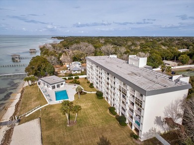Rare opportunity to own a 3rd-floor end unit in the gated - photo 2