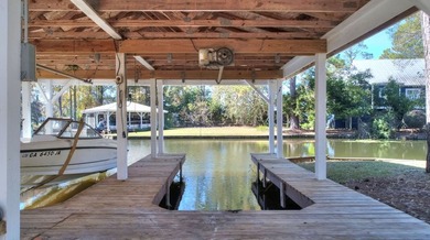 This charming lakefront cottage has new HVAC units and was built - photo 26