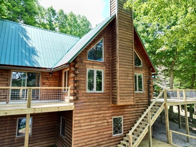 Welcome to 18 Crazy Horse Lane! This stunning lakefront log home - photo 3
