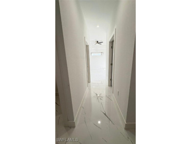 This stunning new construction features impact windows and doors - photo 15