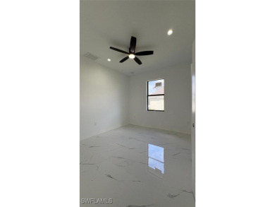 This stunning new construction features impact windows and doors - photo 16